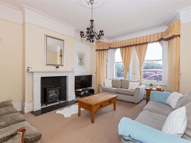 The living room, at the front of the property
