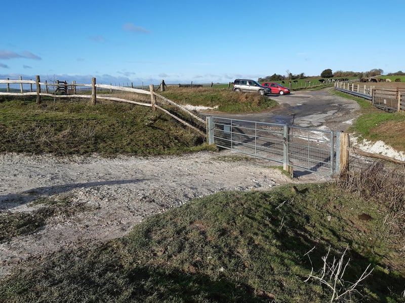 Go through the gate and ahead to the parking area.