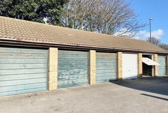 There is a garage outside of the property.