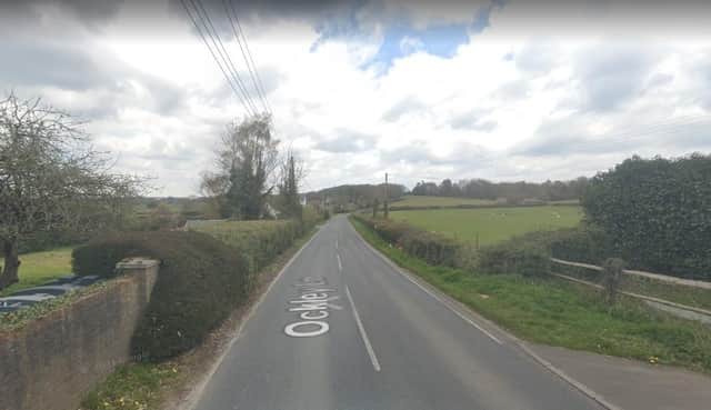 Works have already started to the hedgerow on the right in anticipation of the changes to Ockley Lane (Google Maps Streetview)