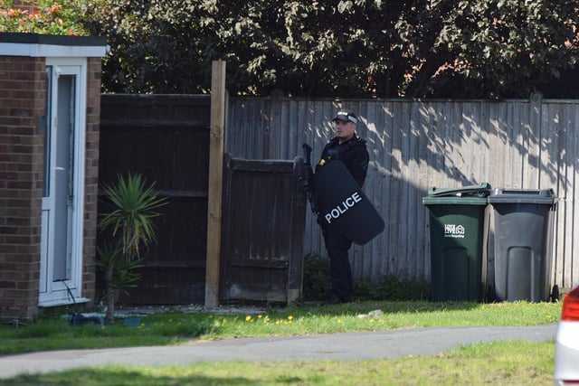 Police at the scene in Milfoil Drive, Eastbourne