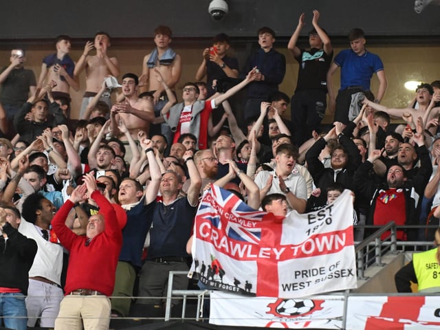 The Crawley Town supporters celebrate during the EFL Sky Bet League 2 play-off second leg match between Milton Keynes Dons and Crawley Town at stadium:mk, Milton Keynes, England on 11 May 2024.:Crawley Town hammered MK Dons 5-1 - and 8-1 on aggregate - to reach the League Two play-off final Wembley. Photographer Dennis Goodwin/Pro Sport Images was there to catch the action, the crowd and the celebrations