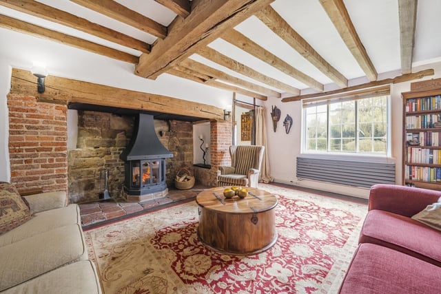 The sitting room has a feature inglenook fireplace