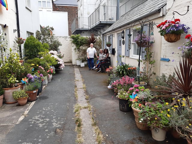 Residents of Brunswick Cottages enjoying their shared courtyard