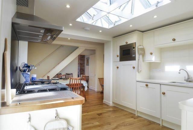 The fitted kitchen has a range-style cooker