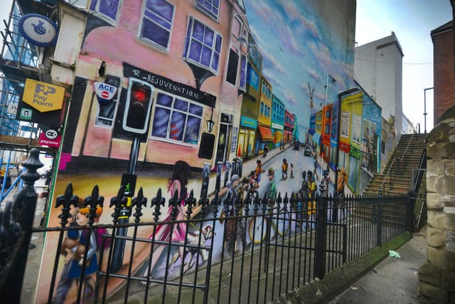 Street scene mural in the passageway leading from London Road to Alfred Street in St Leonards.