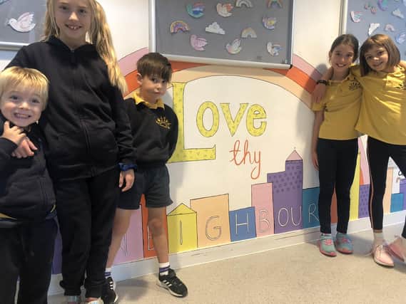 Children at  Holy Trinity School in Lower Beeding with the new mural