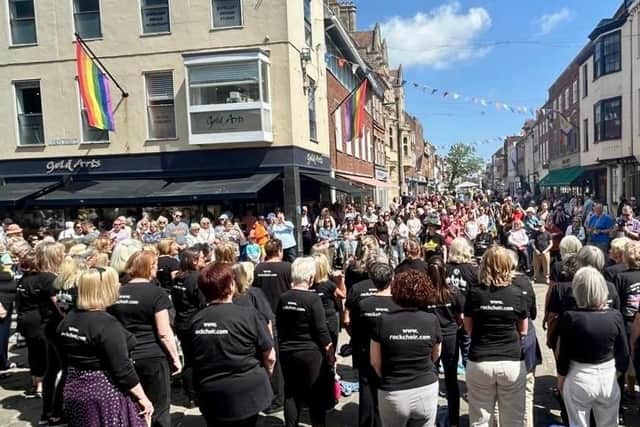Chichester Rock Choir performing in the city centre.