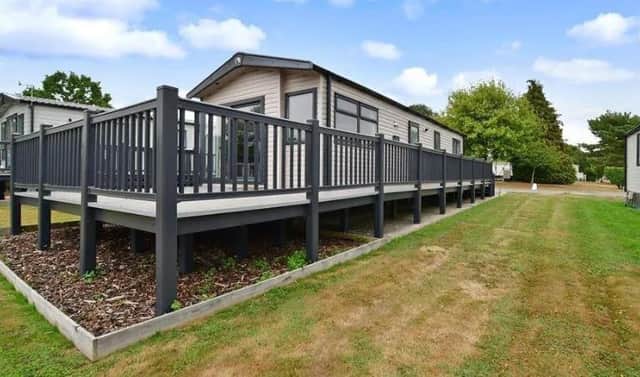 A two-bedroom holiday home near Horsham is on the market for £60,000