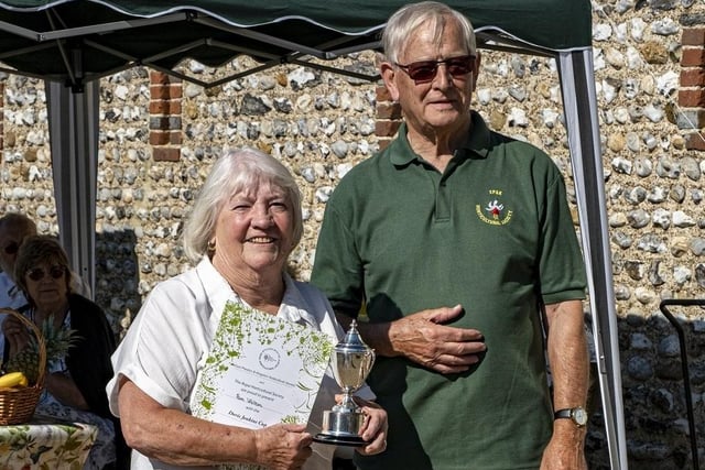 Pam Walton receives the Doris Jenkins Cup from Colin Crane at East Preston and Kingston Horticultural Society flower show