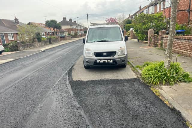 Contractors laying a new surface in Cranleigh Road last week had to work around a parked van, which had failed to move despite residents being given plenty of notice.  Photo: Eddie Mitchell