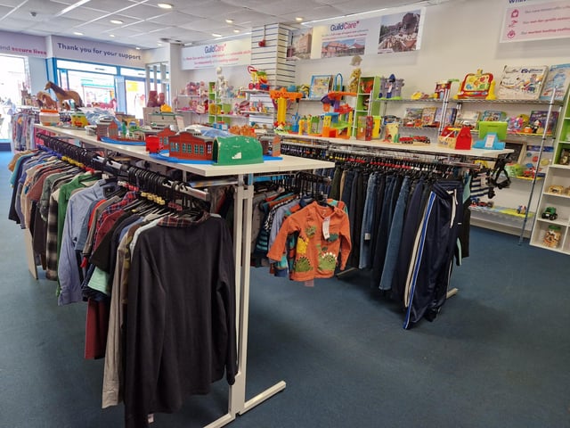 Inside Guild Care's new shop dedicated to children's toys, clothes and equipment, as influencer Jen Graham, known as Charity Shop Girl cuts the ribbon to officially open the Portland Road store