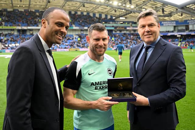 Maheta Molango, CEO of the Professional Footballers' Association, and Richard Masters, Chief Executive of the Premier League, awards James Milner an award in recognition of the most Premier League appearances. (Photo by Mike Hewitt/Getty Images)