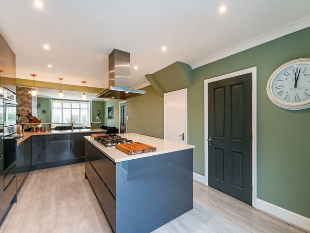 Together, the kitchen and living room come to 30 square feet.