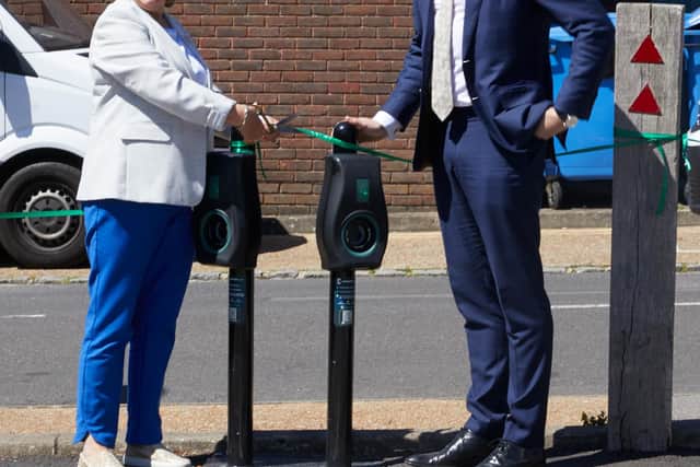 Deborah Urquhart, West Sussex County Council Cabinet Member for Environment and Climate Change, cuts the ribbon to mark the launch of the largest-ever local authority roll-out of electric vehicle charging points in the UK, with Chris Pateman-Jones, CEO of Connected Kerb
