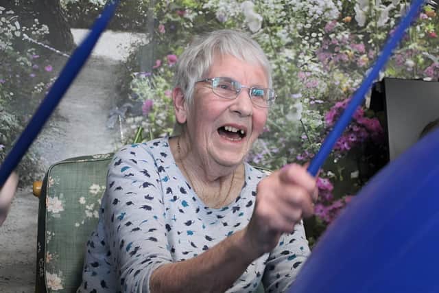 Joyce Chantry enjoying a drum fit session. Picture: Guild Care / Submitted