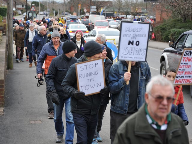 Residents waving hand-made signs. Pic S RobardsSR2303061