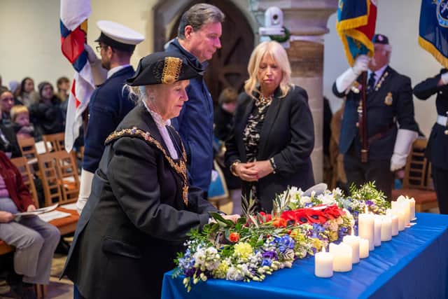 Laying wreaths at the 2025 service, Worthing mayor Cathy Glynn-Davies, Shoreham Lifeboat Station operations manager Andrew Shiner and Worthing Society chair Susan Belton. Picture: Andrew Mardell