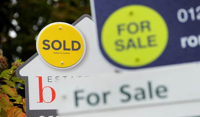 File photo dated 14/10/14 of a sold and for sale signs. A gradual slowdown in the housing market in Scotland is likely as the cost-of-living crisis bites, a report has warned. House prices in Scotland continue to edge upwards but indicators are softening slightly, according to the Royal Institution of Chartered Surveyors (Rics) latest survey. Issue date: Thursday May 12, 2022.