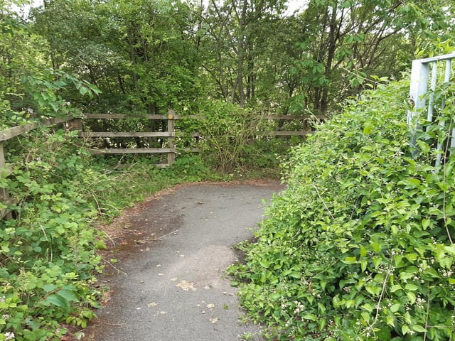 The path takes you to the right, alongside the railway line below, at first.