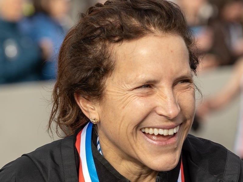 Karima Harris is all smiles at the finish line - her gun time of 35.54 is a world record for the female over-55 age group at the 10k distance