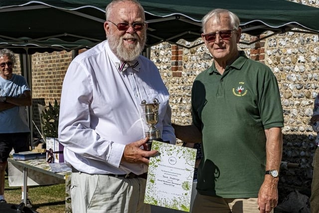 David Stubbings receives the David Mackenzie Thorowgood Memorial Cup from Colin Crane at East Preston and Kingston Horticultural Society flower show