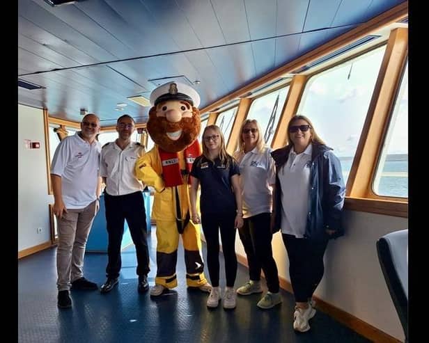 Volunteers of Newhaven RNLI with DFDS Captain and Stormy Stan