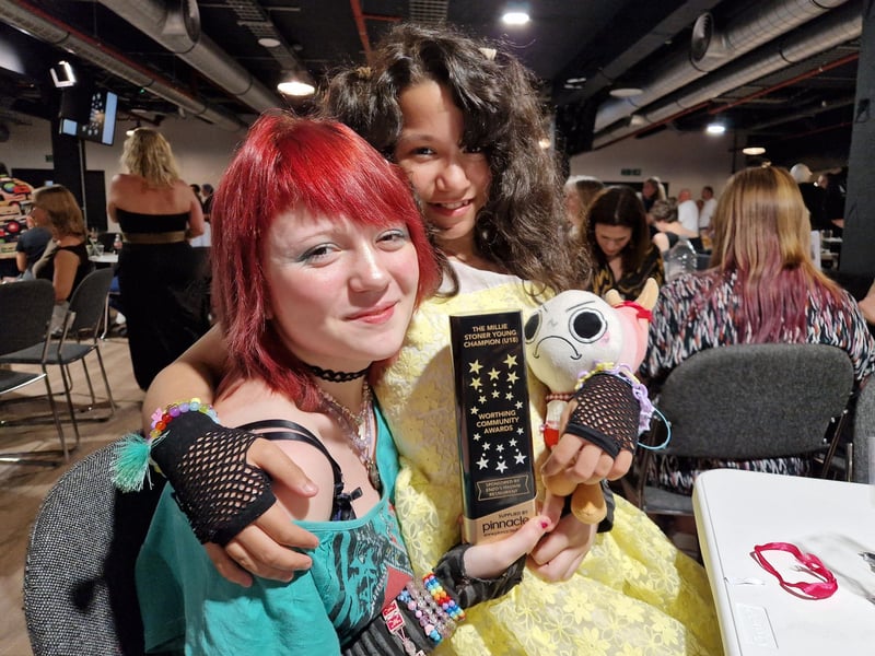Karma Terrell, seated, was named Millie Stoner Young Champion for helping care for her younger siblings