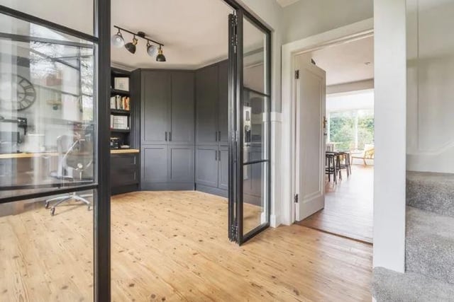 A reception hallway has a set of stylish double glass doors which open into a study providing an ideal work from home space.