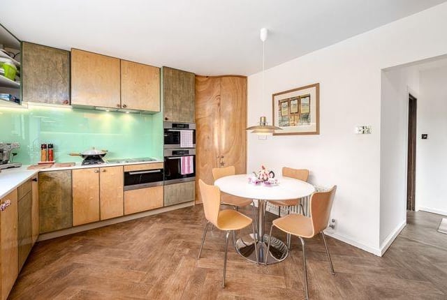 There are a large number of base and full height wall units in the kitchen.