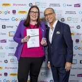 Nic Gray receiving her certificate from Theo Paphitis
