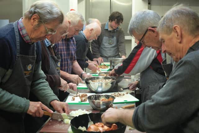 Man with a Pan - Participants on one of our cookery courses. 