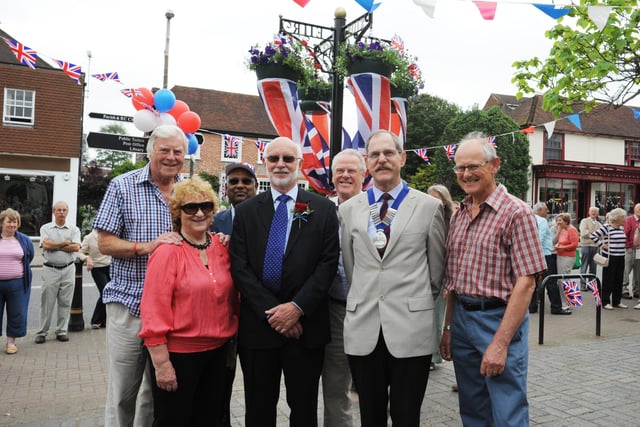 Henfield unveil permanent Diamond Jubilee steel hanging basket post with royal insignia in High Street outside Barclays Bank by district and parish councillors.  Left to right: Peter Hudson (former parish council chairman), Sheila Matthews (Horsham District Councillor), Arun Argarwal (Parish Councillor), Mike Morgan (Parish Councillor), Lionel Barnard (County Councillor), Ray Osgood (Parish Council chairman) and Tony Jackson (Henfield Community Partnership chairman)