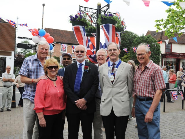 Henfield unveil permanent Diamond Jubilee steel hanging basket post with royal insignia in High Street outside Barclays Bank by district and parish councillors.  Left to right: Peter Hudson (former parish council chairman), Sheila Matthews (Horsham District Councillor), Arun Argarwal (Parish Councillor), Mike Morgan (Parish Councillor), Lionel Barnard (County Councillor), Ray Osgood (Parish Council chairman) and Tony Jackson (Henfield Community Partnership chairman)