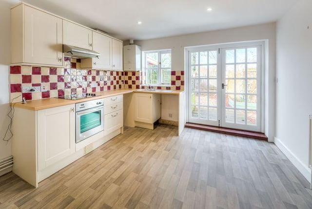 The spacious kitchen/diner has french doors leading to the property's garden.