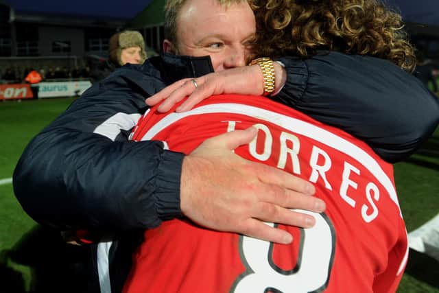 Steve Evans hugs Sergio Torres after Crawley's historic win over Torquay in the FA Cup | Picture: Jon Rigby