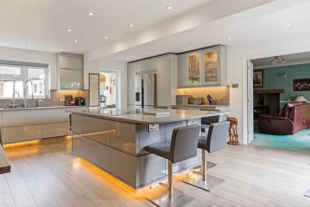 There is a beautiful contemporary kitchen in the centre of the house