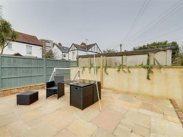 The garden has a raised patio, providing space for garden furniture