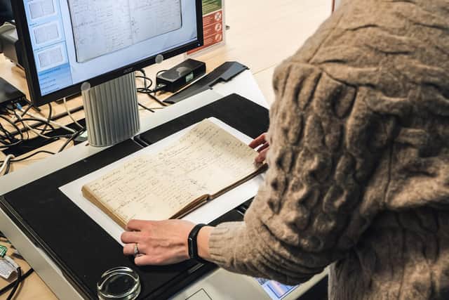 Scanning the original 1890 brewing notes at The Keep. Photo: Harvey’s Brewery