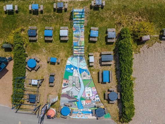 A seaside pub in East Sussex has made the 10 metre-long mural, made up of local landmarks including a castle and a windmill, the centrepiece of its pub garden.