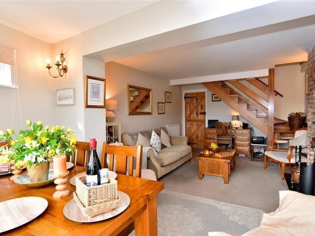 This two-bedroom cottage is on the market at £600,000 with Cubitt & West. This is a rare opportunity to own a charming riverside cottage within the desirable conservation area of historic Arundel.