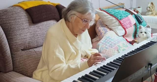 Teresa Ford playing the keyboard gifted to the home by her family