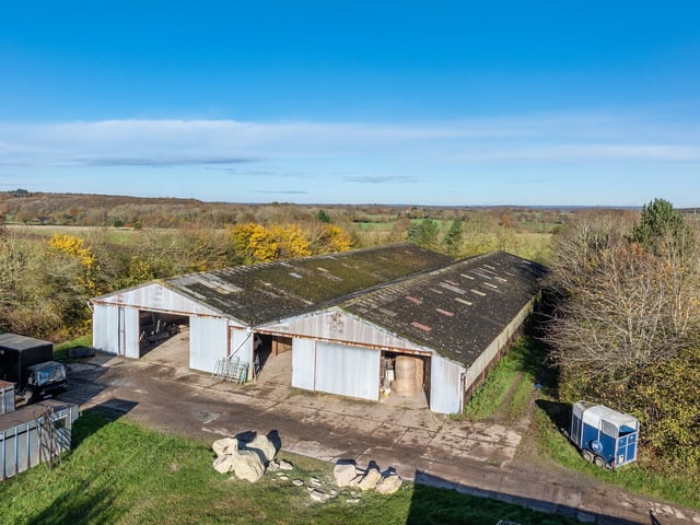The property has a series of contemporary steel portal frame livestock building