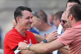In happier times: Paul Barnes meets the Hastings fans at Dulwich | Picture: Scott White