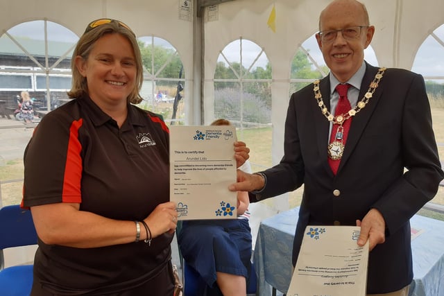 Nikki Richardson, general manager at Arundel Lido, is presented with a certificate by Arundel mayor Tony Hunt