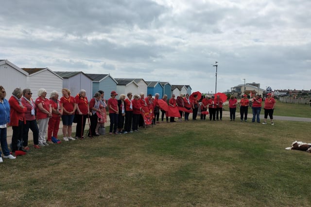 Sussex Central Trefoil Guild members joined together  at Lancing Beach Green to form a ‘Sea of Red’ as part of the London and South East England (LaSER) celebration of Trefoil’s 80th birthday.