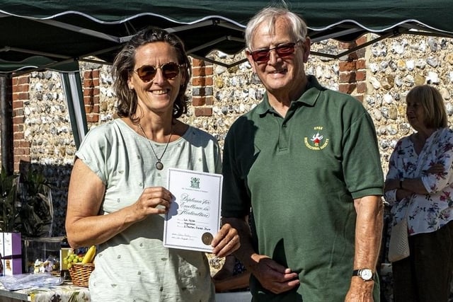Liz Miles receives the Best Vegetable award from Colin Crane at East Preston and Kingston Horticultural Society flower show
