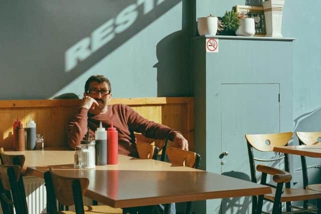 High Street Eats: Man in Café. Taken by Seán Anthony in Tottenham High Road, London, September 2022  