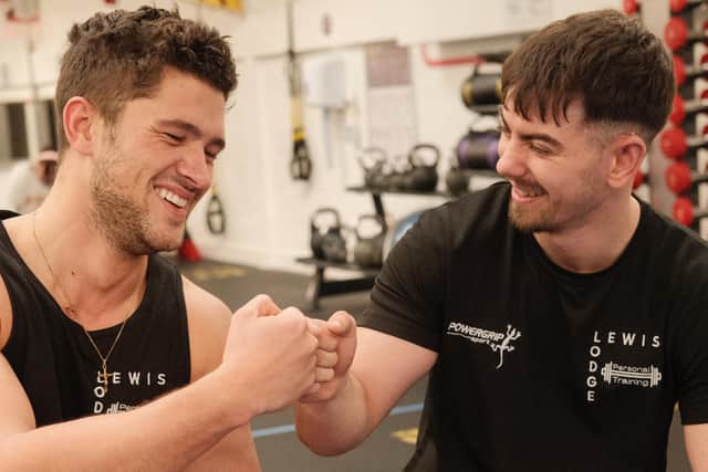 Worthing personal trainer Lewis Lodge, right, with reality star Jordan Davies