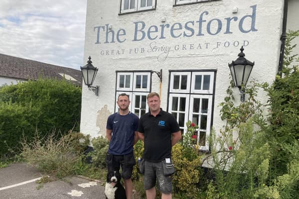 Ben with Harry and Pablo the pub pooch. Picture: Carl Eldridge